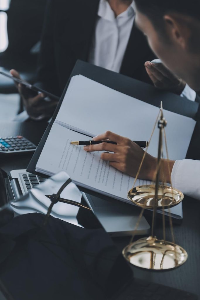 Legal documents and scales representing trust administration and fiduciary oversight services