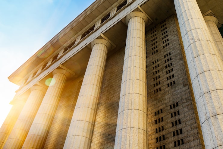 Classical building columns representing trustee and private fiduciary services at RMA Law Group
