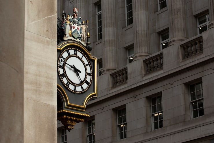 Historic clock on building facade representing proactive estate planning reviews and updates